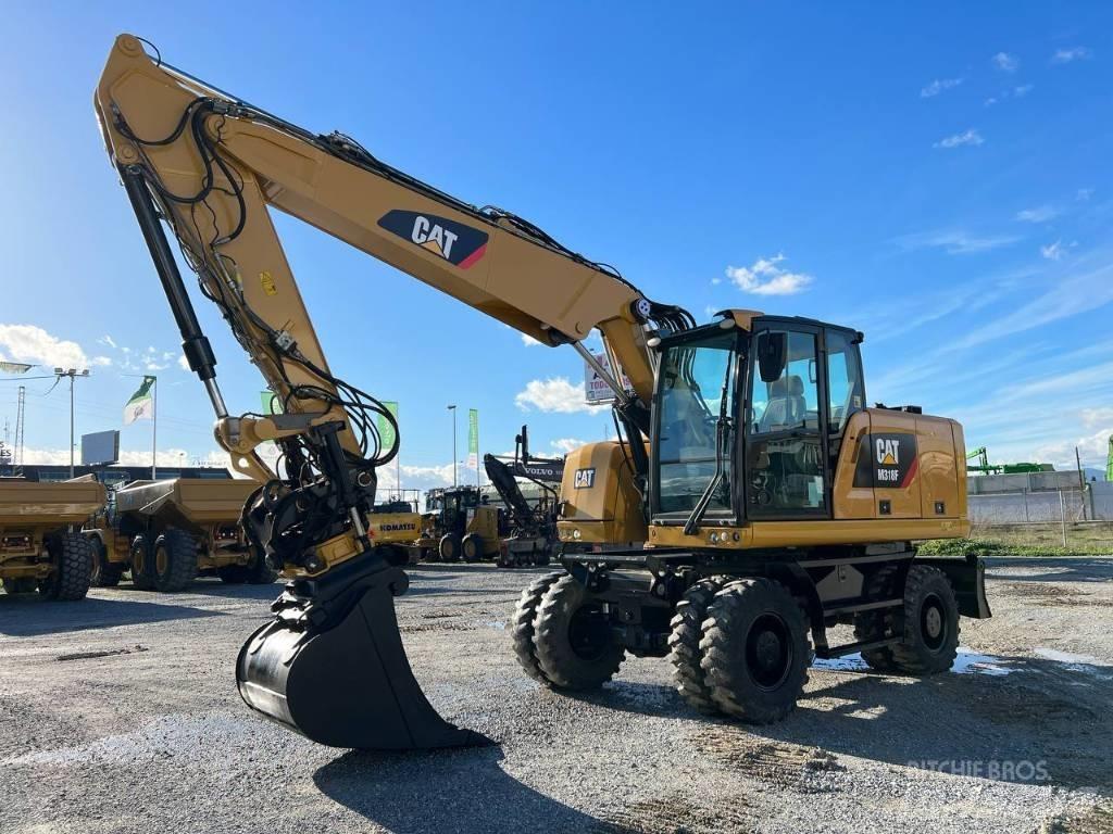 CAT M 318 F Pelle sur pneus
