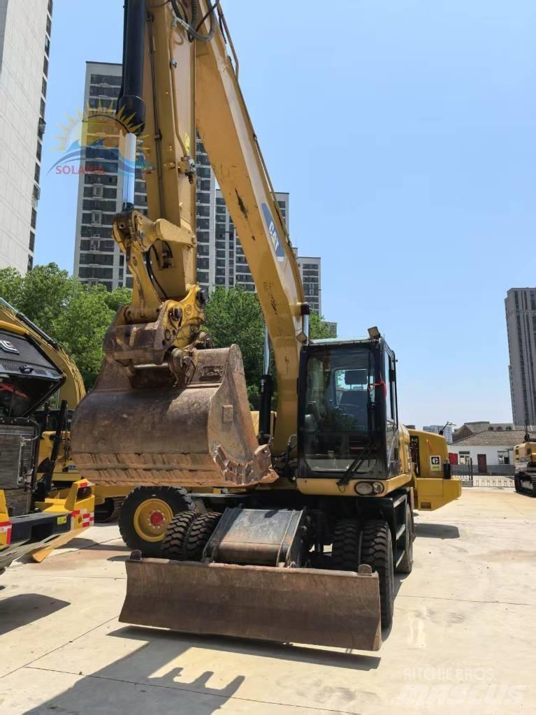 CAT M 315 D2 Pelle sur pneus