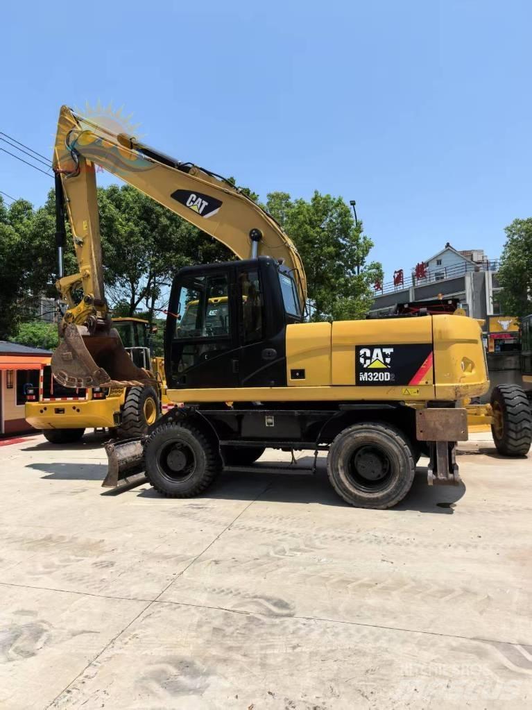 CAT M 315 D2 Pelle sur pneus
