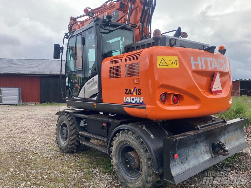 Hitachi 140w Pelle sur pneus