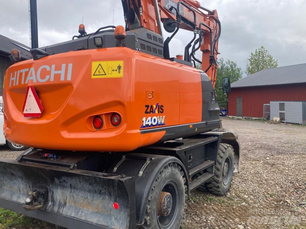 Hitachi 140w Pelle sur pneus