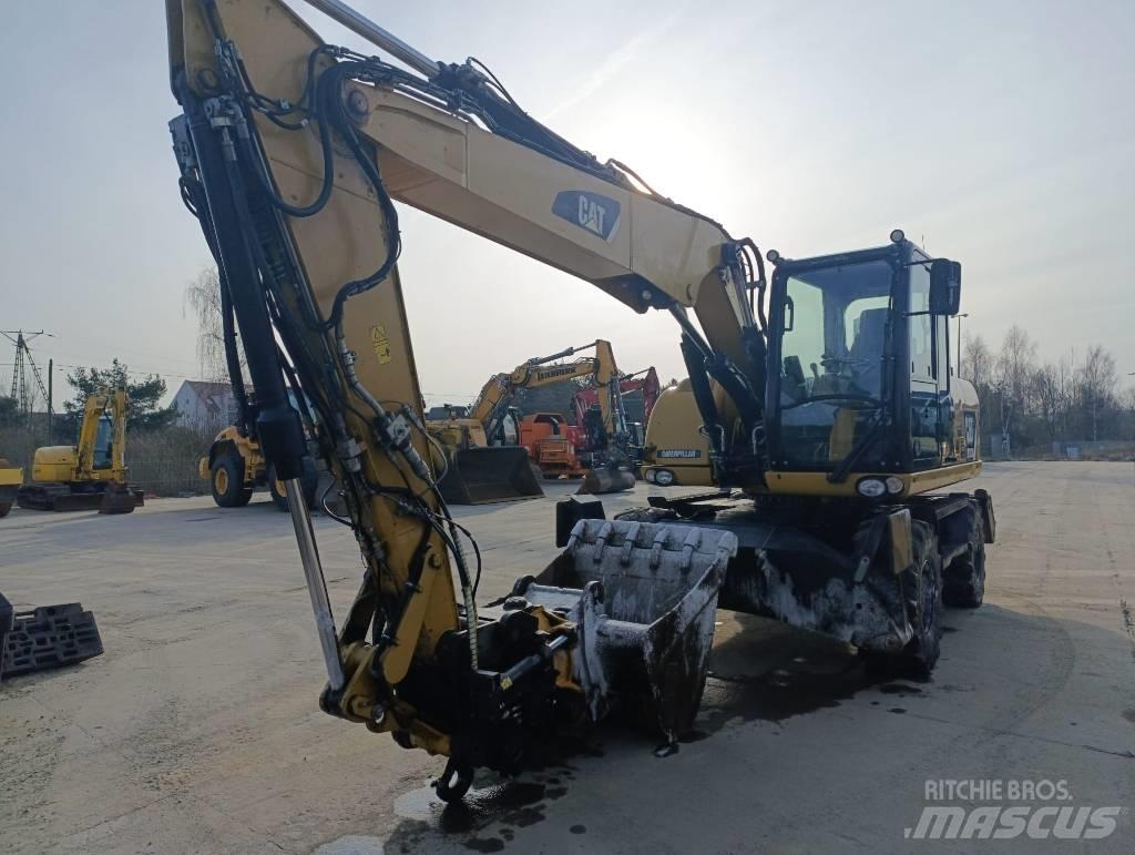 CAT M 313 D Pelle sur pneus