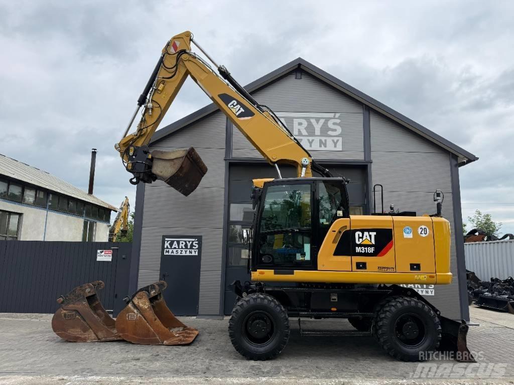 CAT M316F Pelle sur pneus