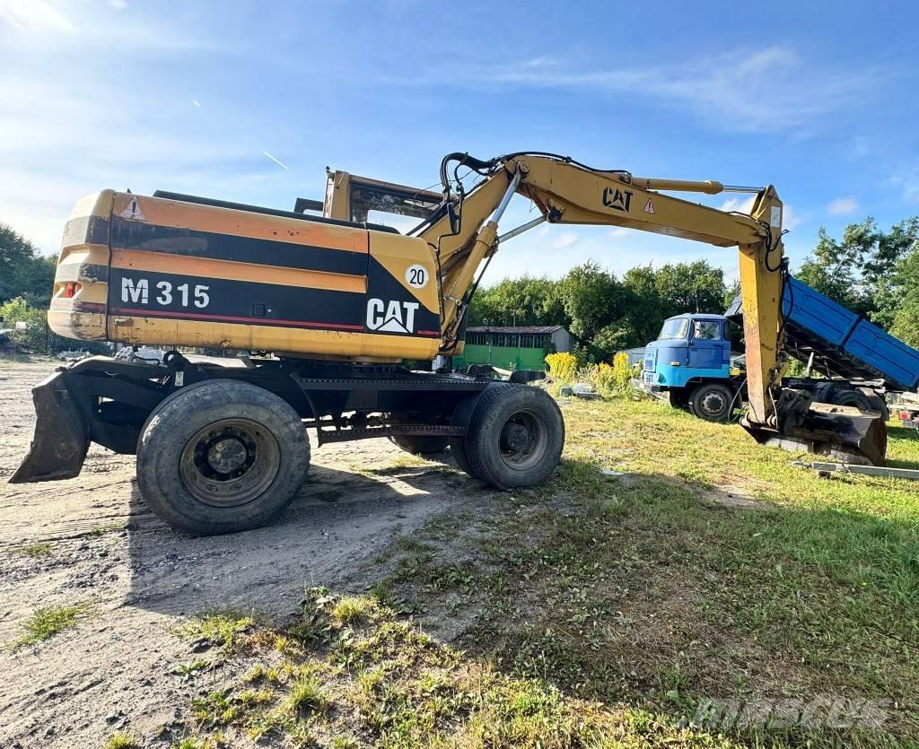 CAT M 315 Pelle sur pneus