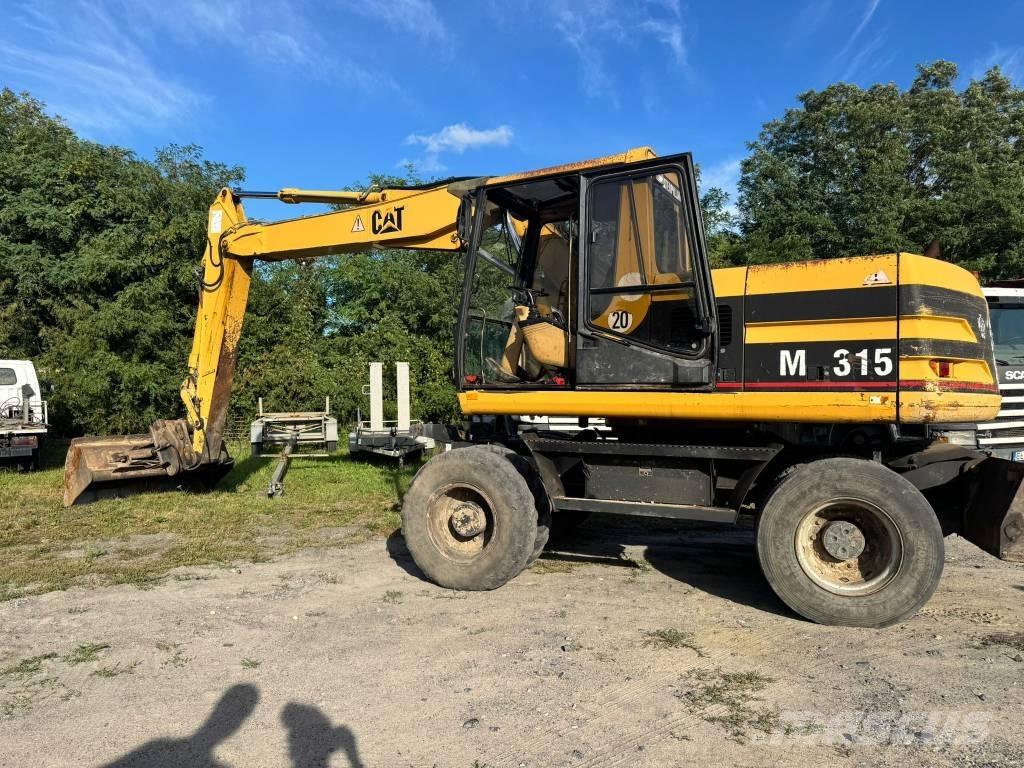 CAT M 315 Pelle sur pneus