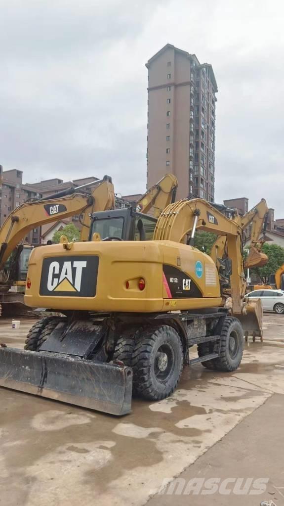 CAT M 315 D Pelle sur pneus