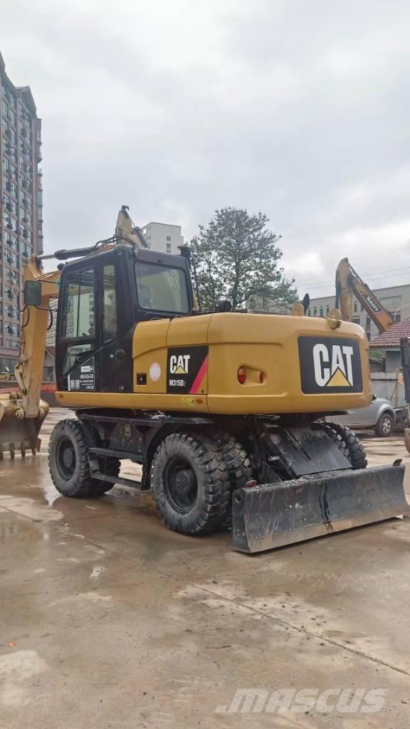 CAT M 315 D Pelle sur pneus