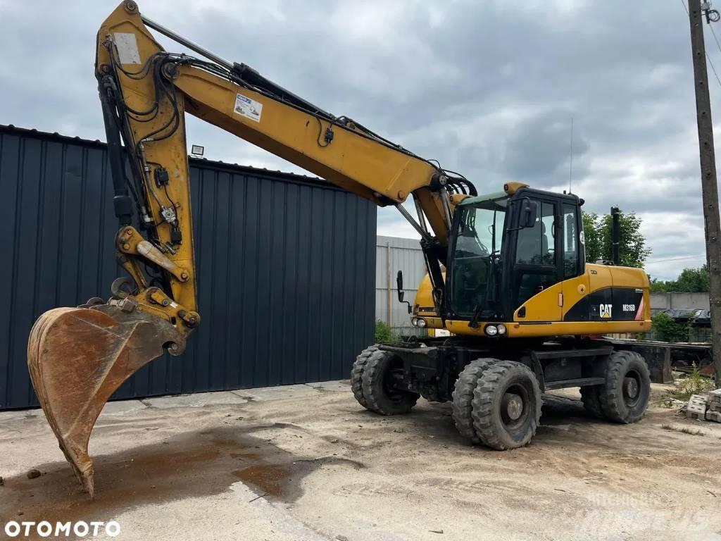 CAT M 316 D Pelle sur pneus