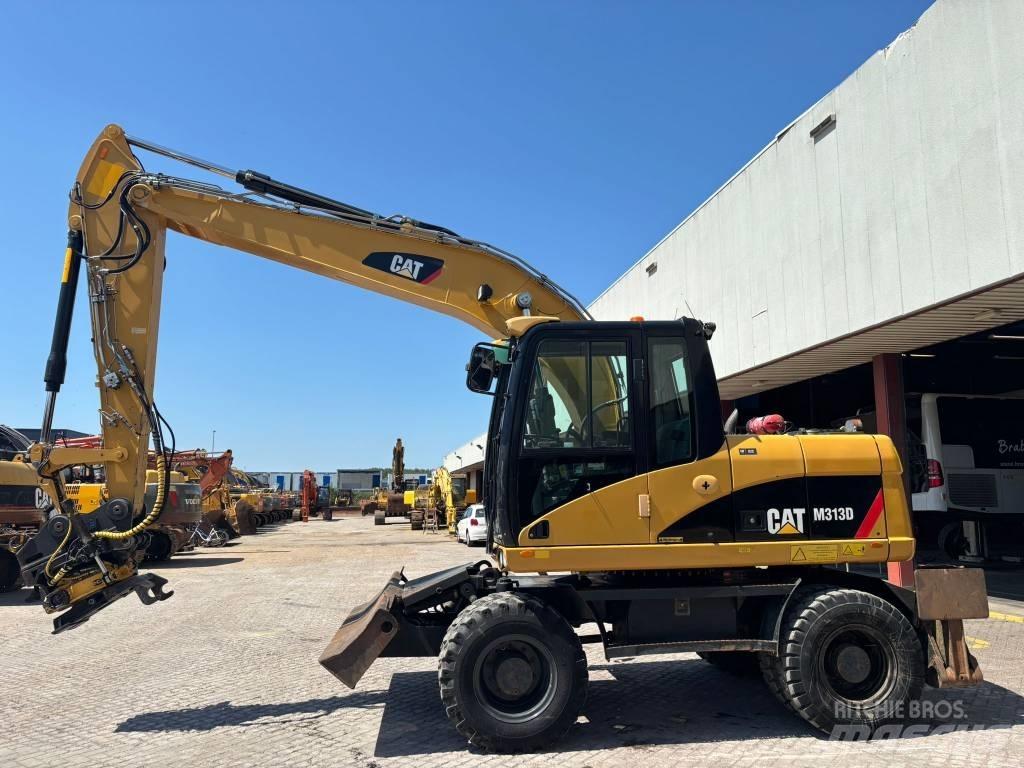 CAT M 313 D Pelle sur pneus