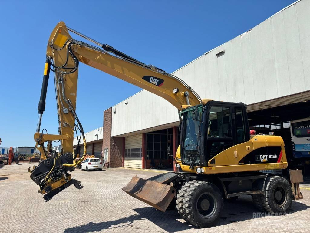 CAT M 313 D Pelle sur pneus