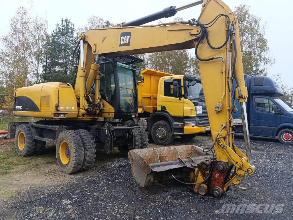 CAT M 318 C Pelle sur pneus