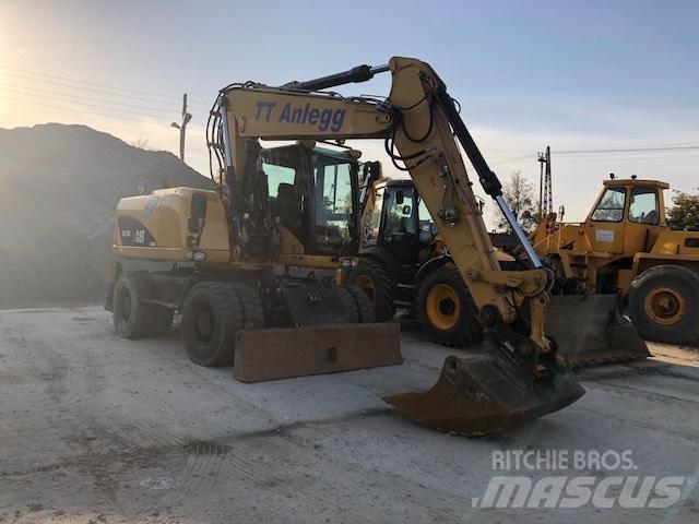 CAT M 315 D Pelle sur pneus