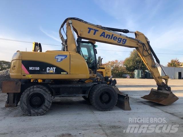 CAT M 315 D Pelle sur pneus