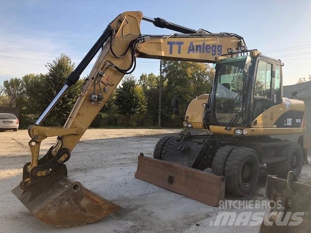 CAT M 315 D Pelle sur pneus