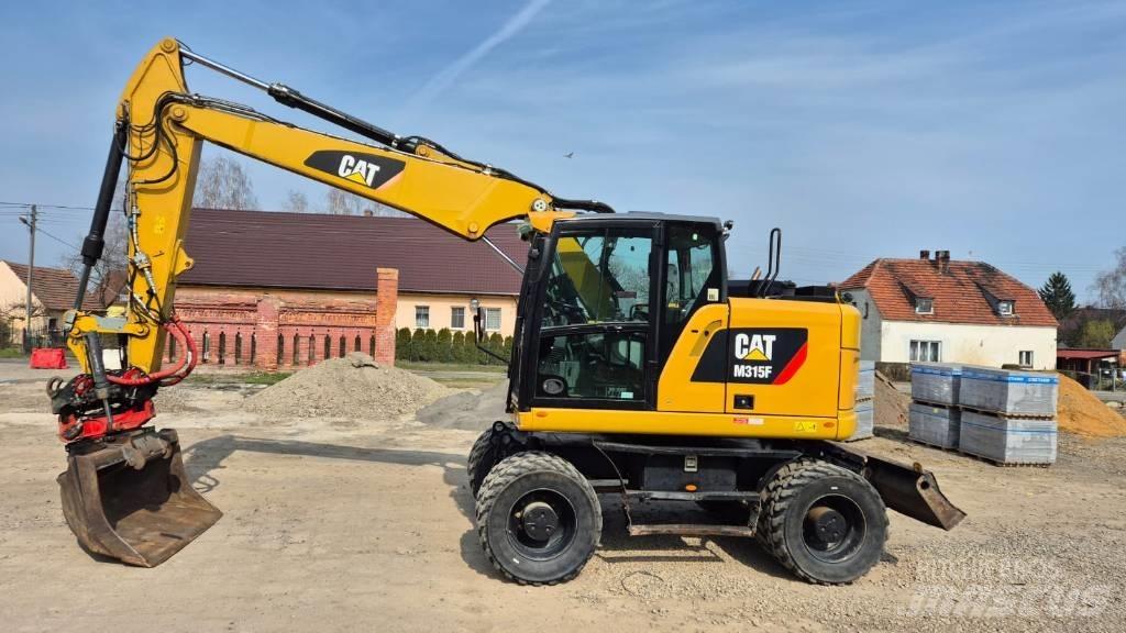 CAT M 315 F Pelle sur pneus