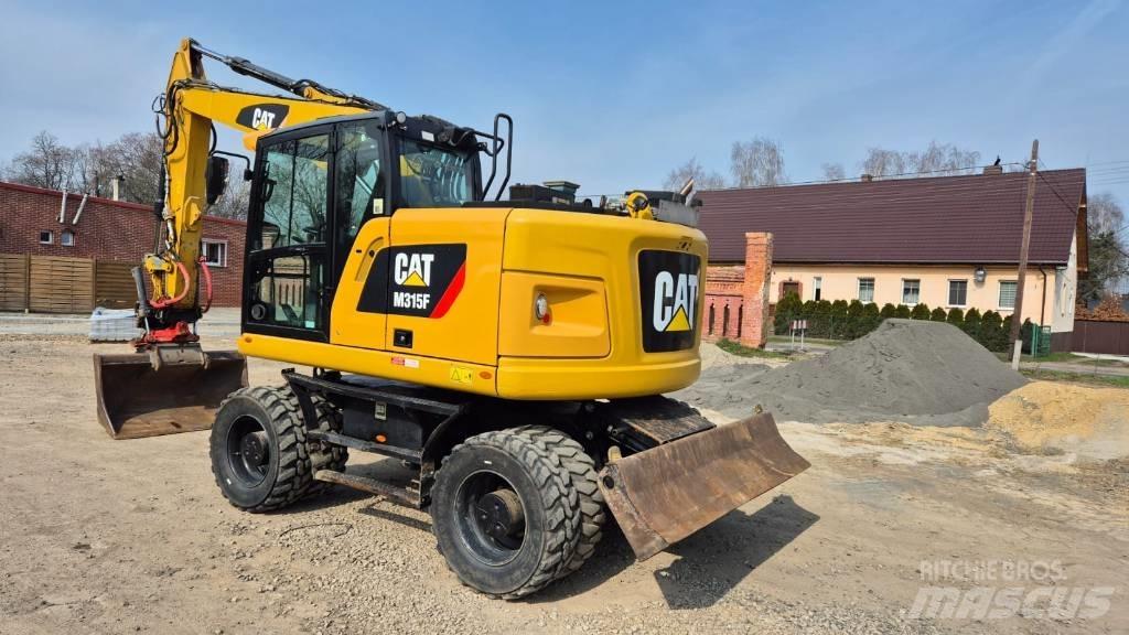 CAT M 315 F Pelle sur pneus
