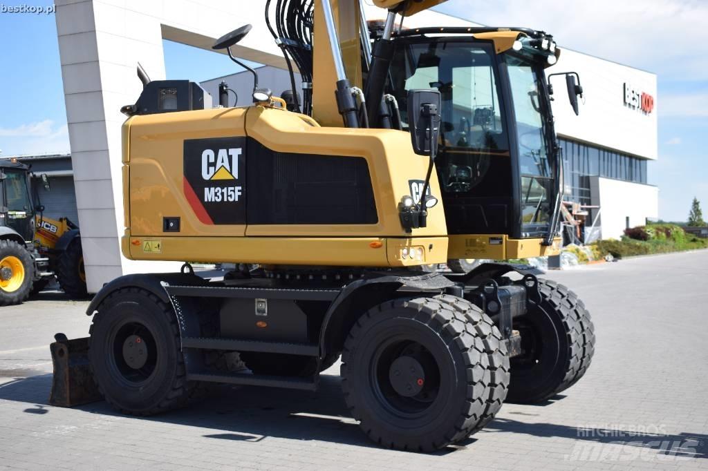 CAT M 315 F Pelle sur pneus