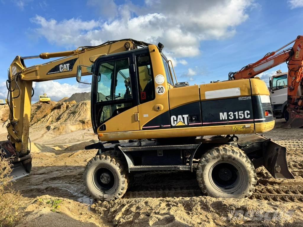 CAT M 315 C Pelle sur pneus