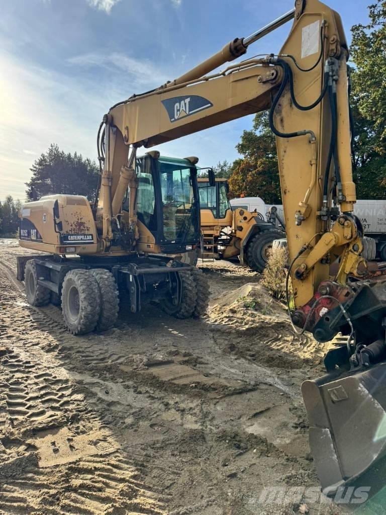 CAT M 315 C Pelle sur pneus