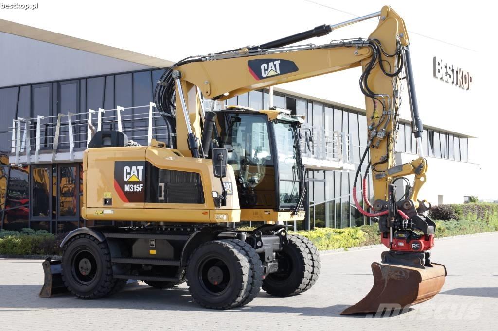 CAT M 315 F Pelle sur pneus