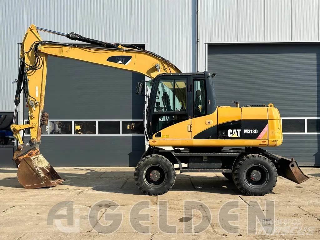 CAT M313D Pelle sur pneus