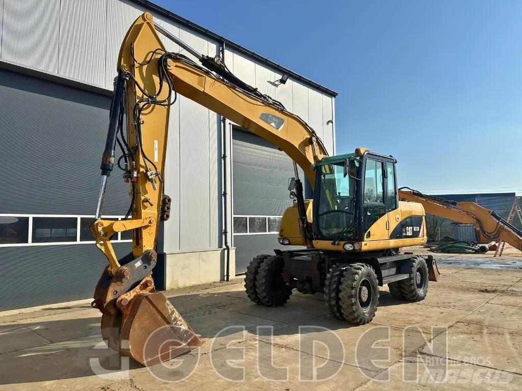 CAT M313D Pelle sur pneus