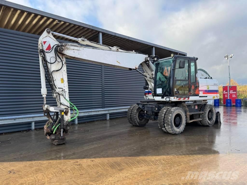 CAT M315D Pelle sur pneus