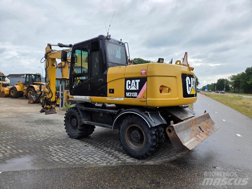 CAT M313D Pelle sur pneus
