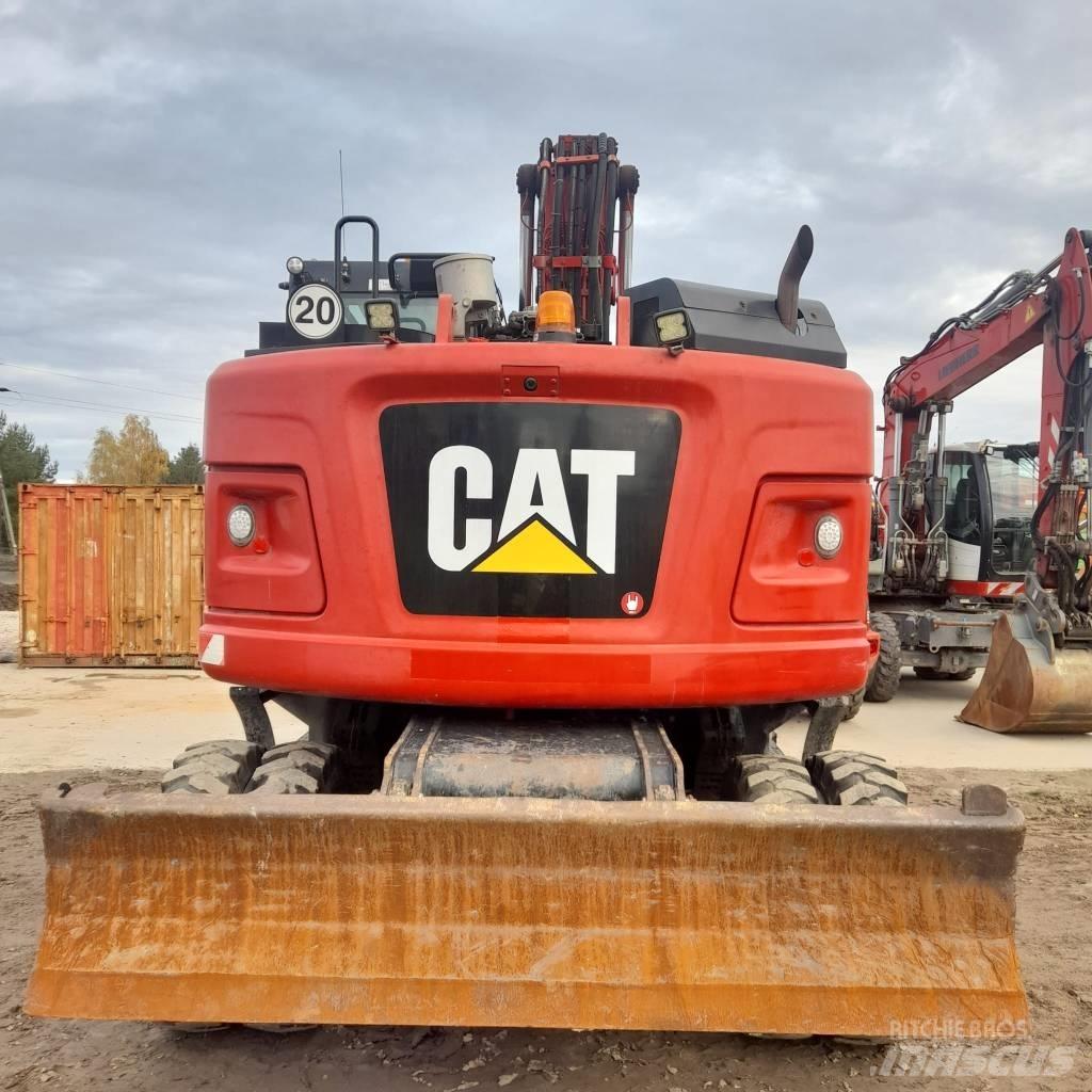 CAT M317 Pelle sur pneus