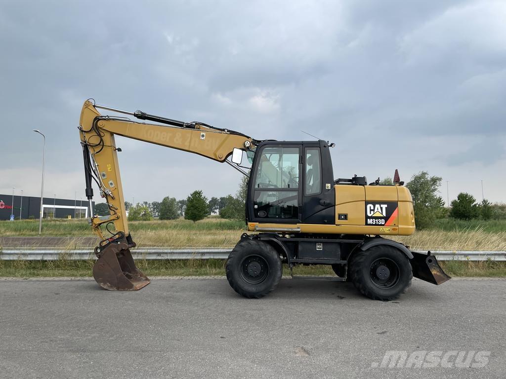 CAT M313D - CE Pelle sur pneus