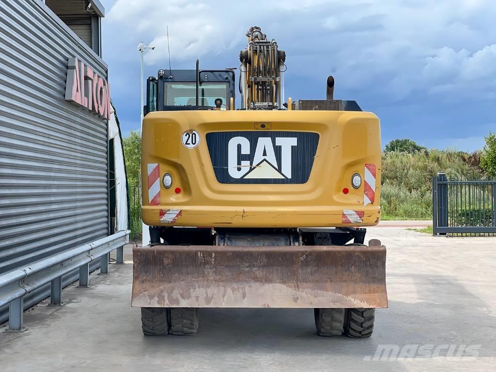 CAT M318F Pelle sur pneus