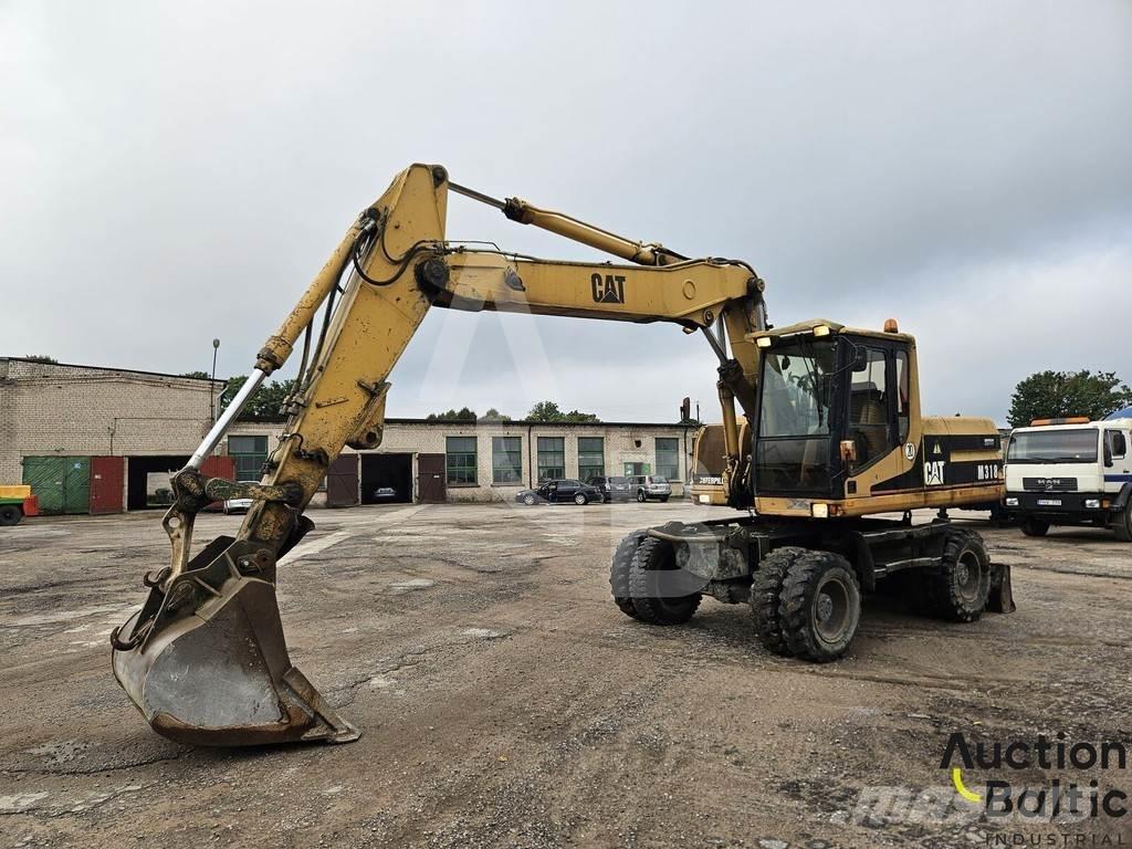 CAT M 318 C Pelle sur pneus