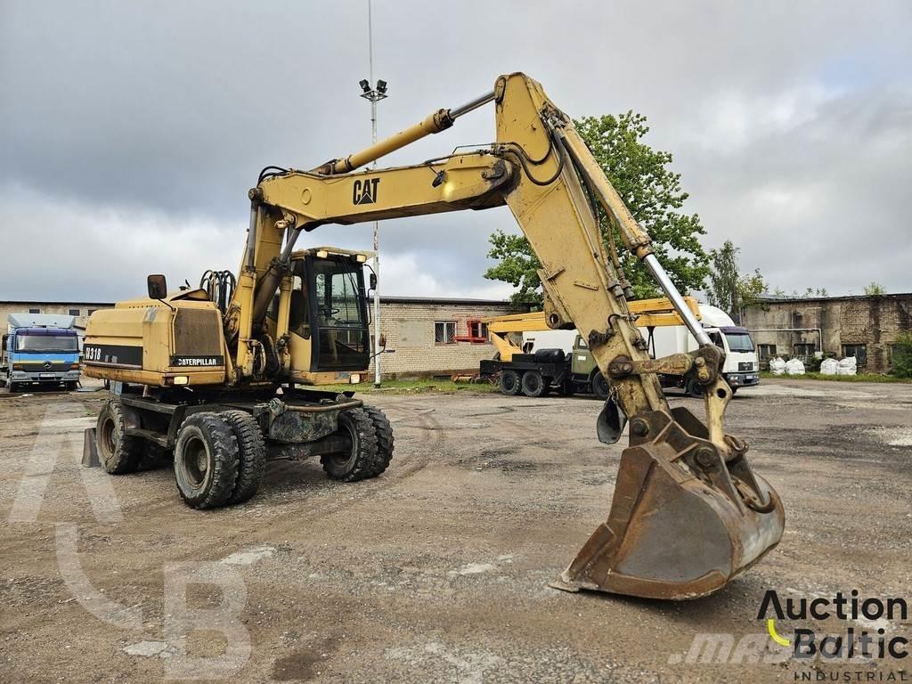 CAT M 318 C Pelle sur pneus