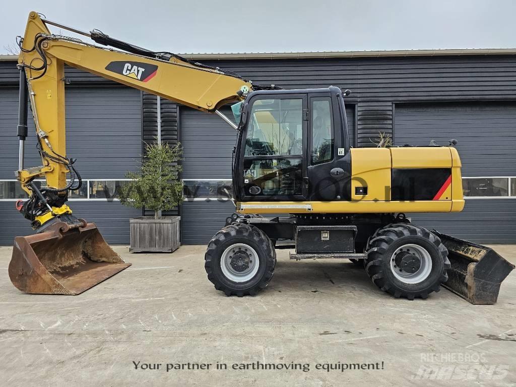 CAT M 315 D Pelle sur pneus