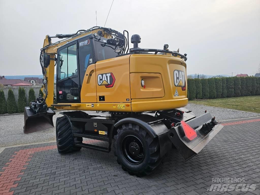 CAT M 315 F Pelle sur pneus