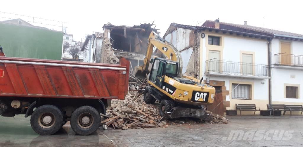 CAT M318d Pelle sur pneus