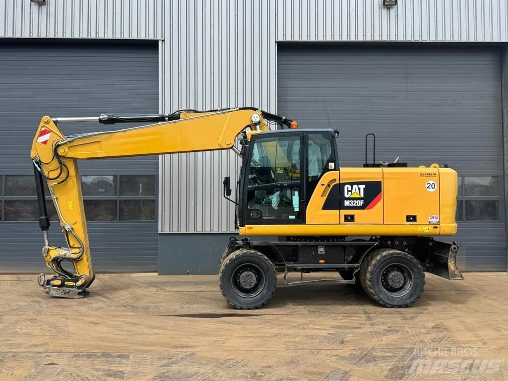 CAT M320F Pelle sur pneus