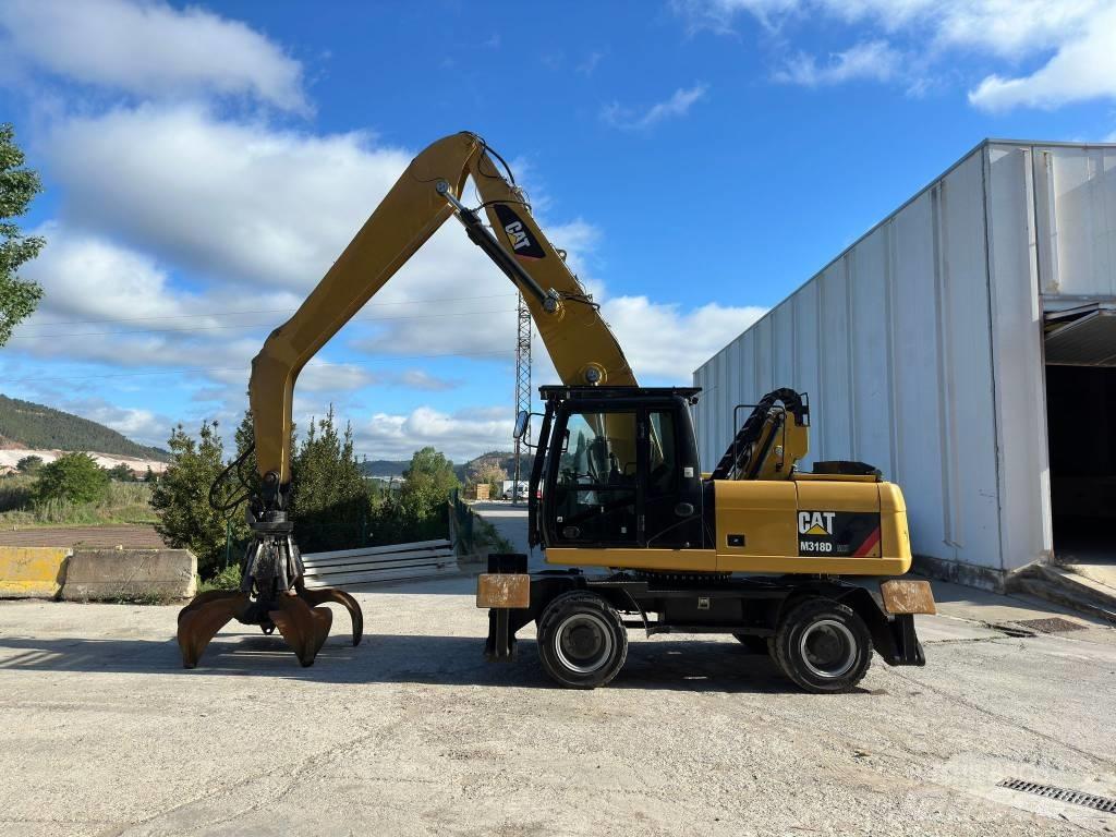 CAT M 318 MH Pelle sur pneus
