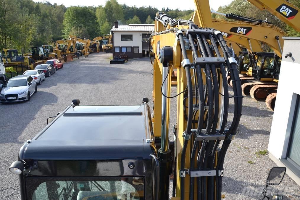 CAT M 315 D Pelle sur pneus