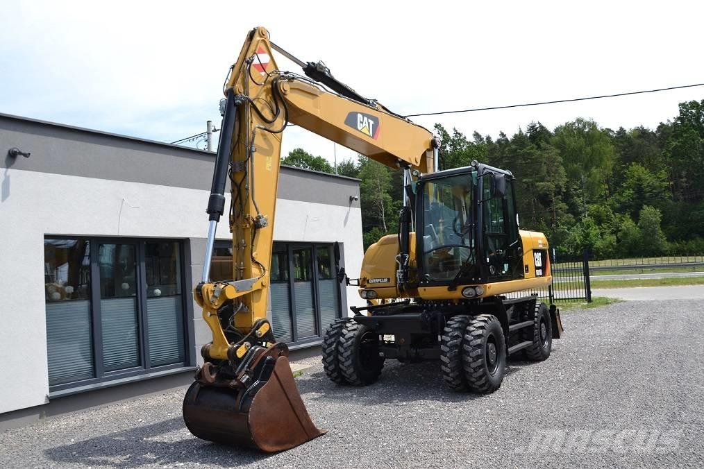 CAT M 315 D Pelle sur pneus