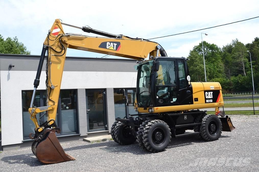 CAT M 315 D Pelle sur pneus