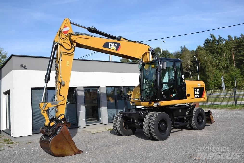 CAT M 315 D Pelle sur pneus