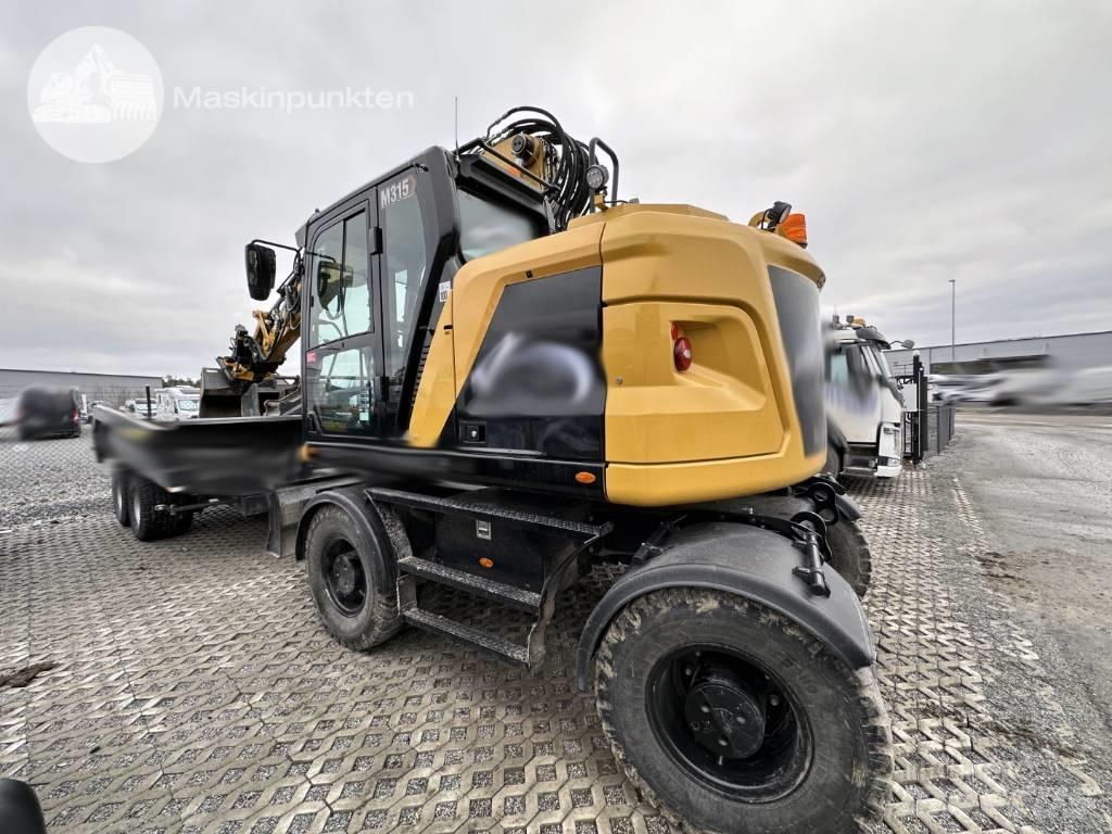 CAT M 315 Pelle sur pneus