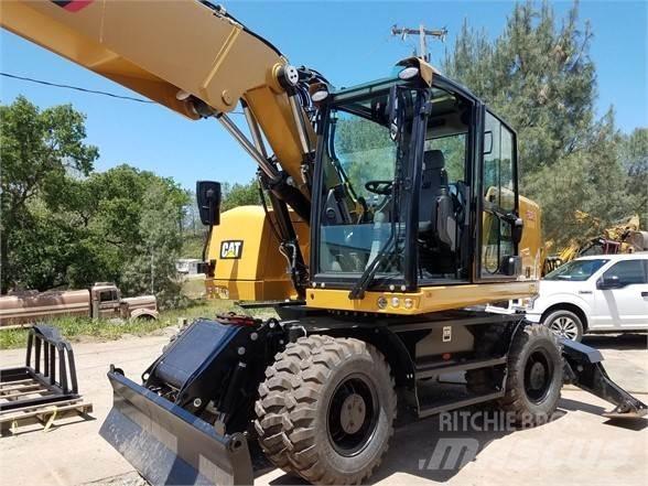 CAT M318F Pelle sur pneus