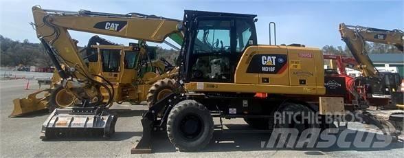 CAT M318F Pelle sur pneus