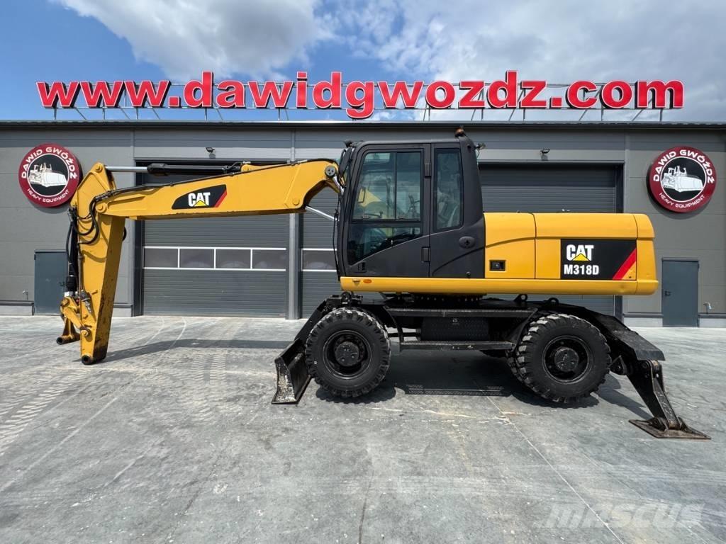 CAT M 318 D Pelle sur pneus