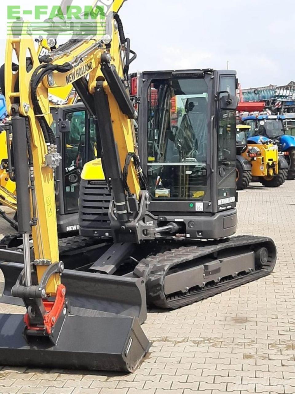 New Holland e65d Pelle sur pneus