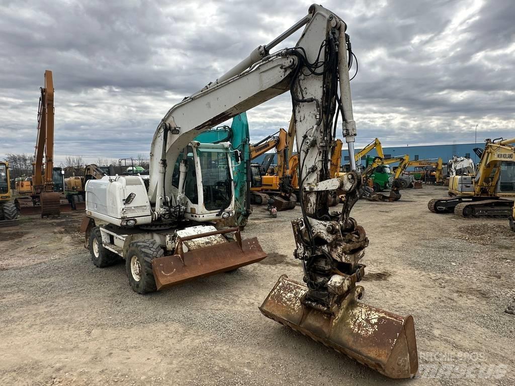 CAT M 316 D Pelle sur pneus