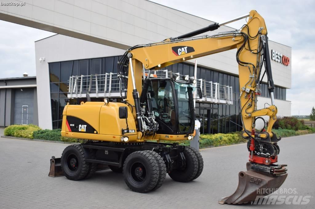 CAT M 313 D Pelle sur pneus