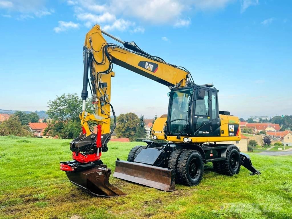 CAT M 315 D Pelle sur pneus